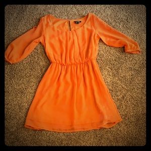 A Orange my michelle dress with crisscross sleeves